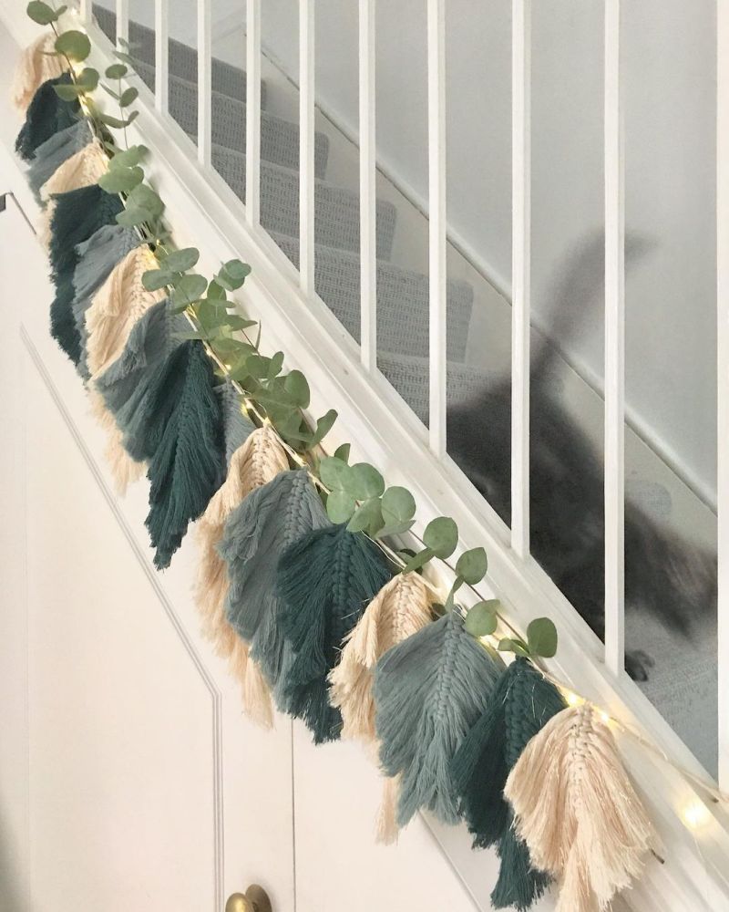 Macramé garland and eucalyptus leaves for staircase decoration 