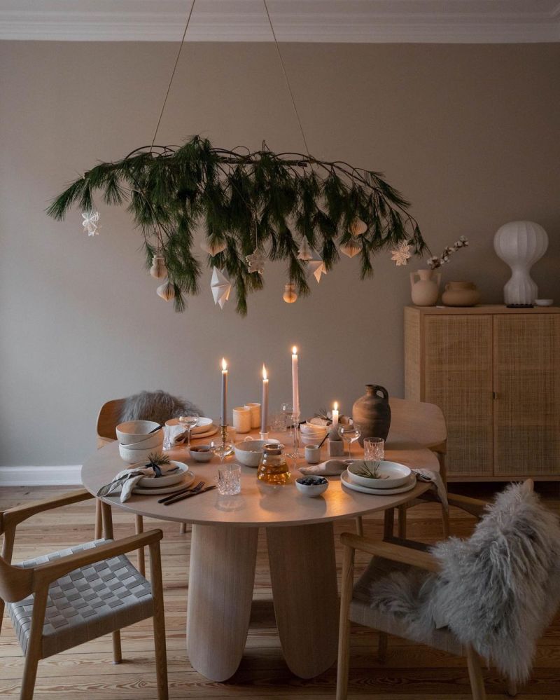 wood branch hanging over Christmas dining Table