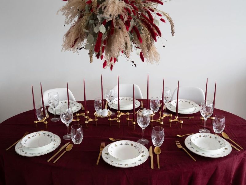 red themed Christmas Dining Table Decoration with candles and table cloth  