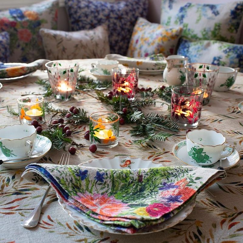 use glasses for candles and greenery for Christmas Tablescape 