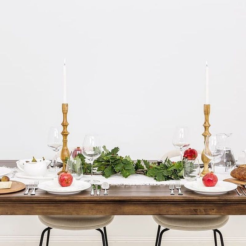 Christmas Tablescape with wooden candle holders along with red and green accents 