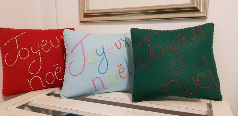 Christmas-themed embroidered cushion covers