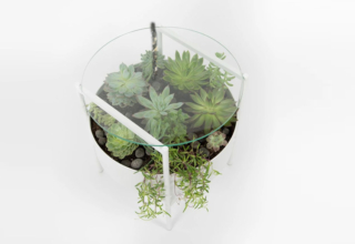Palm Urban’s Green Glass Table has Built-in Planter