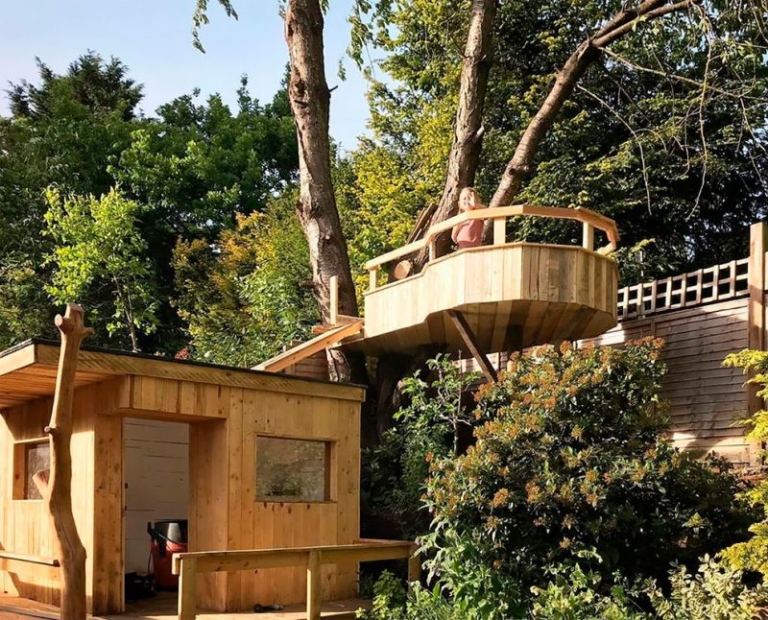 Dad Builds Garden Treehouse with Slides For His Daughters