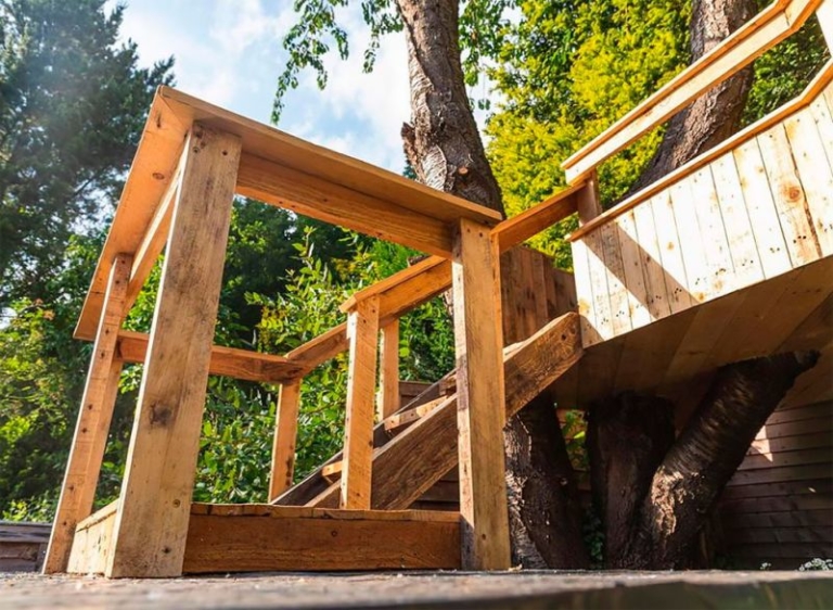 Dad Builds Garden Treehouse with Slides For His Daughters