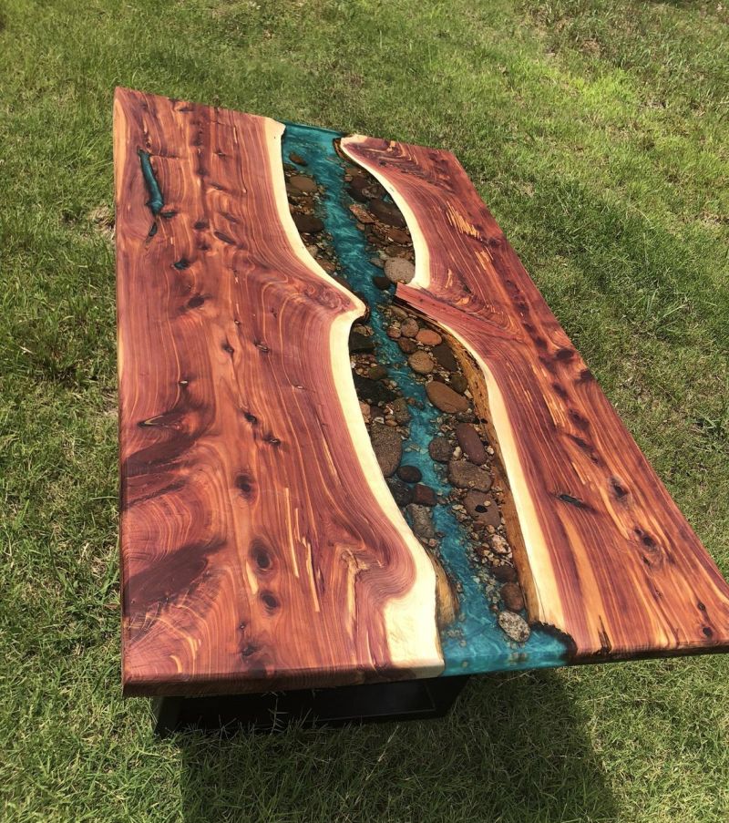 This Live Edge River Dining Table has Stones along the Banks