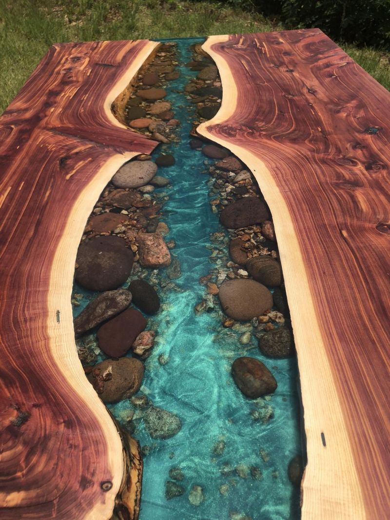 This Live Edge River Dining Table has Stones along the Banks