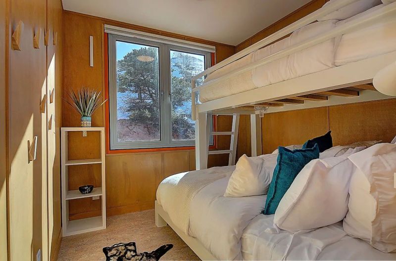 Nestled in the foothills of the Sangre de Cristo Mountains, this orange shipping container rental home is a cool getaway near Salida, Colorado