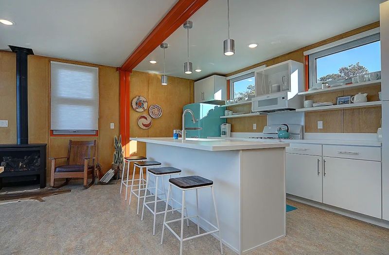 Nestled in the foothills of the Sangre de Cristo Mountains, this orange shipping container rental home is a cool getaway near Salida, Colorado