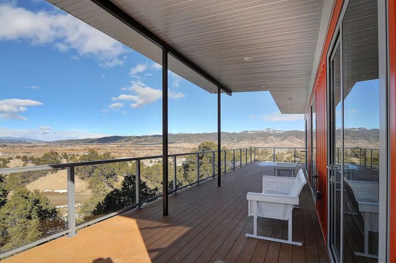 Nestled in the foothills of the Sangre de Cristo Mountains, this orange shipping container rental home is a cool getaway near Salida, Colorado