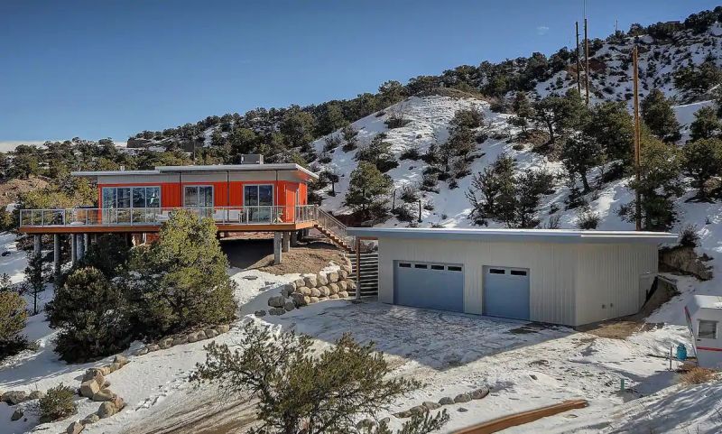 Nestled in the foothills of the Sangre de Cristo Mountains, this orange shipping container rental home is a cool getaway near Salida, Colorado