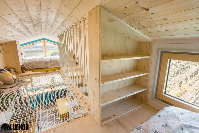 This Tiny House Features Netted Floor to Connect Loft Bedrooms