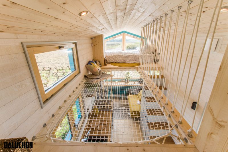 This Tiny House Features Netted Floor to Connect Loft Bedrooms