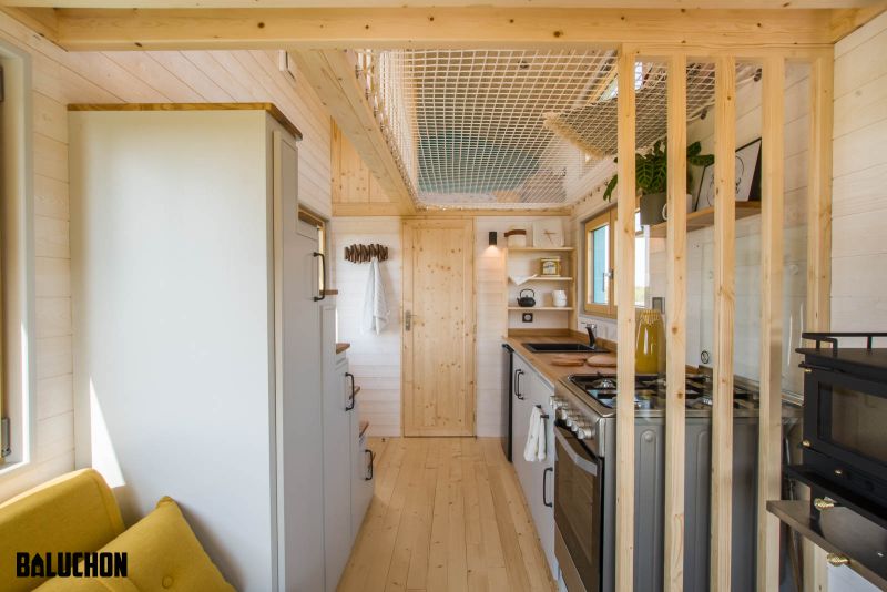 This Tiny House Features Netted Floor to Connect Loft Bedrooms