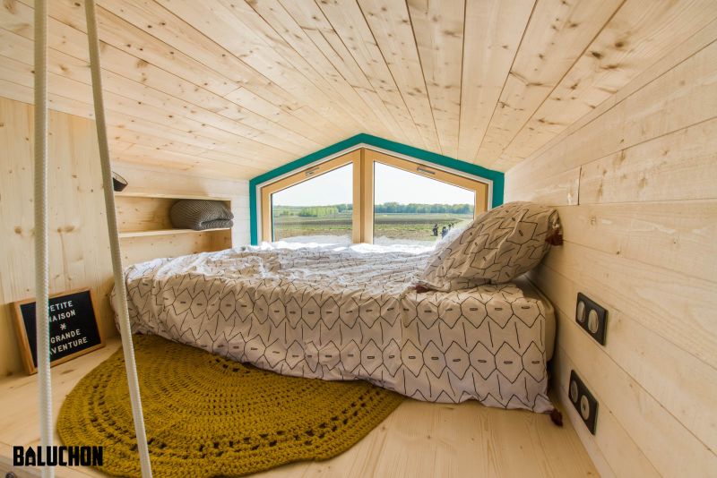 This Tiny House Features Netted Floor to Connect Loft Bedrooms