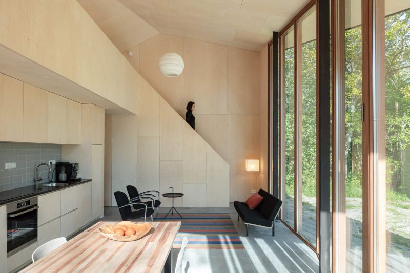 Orange Architects Builds Wooden Holiday Home with Transforming Interiors