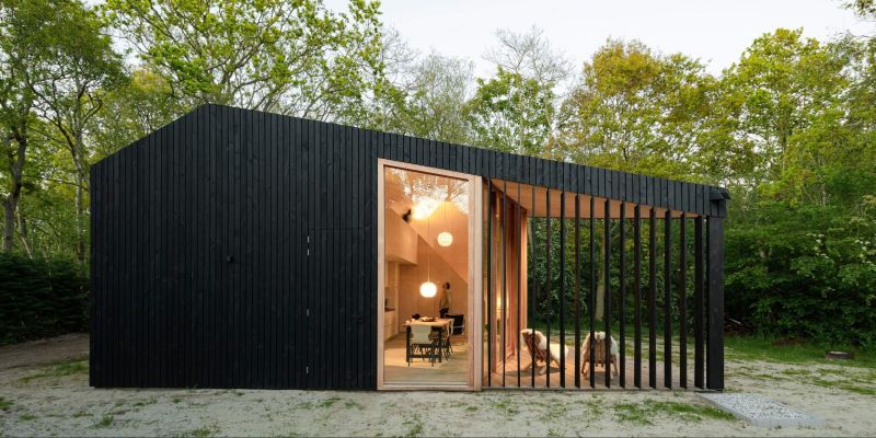 Orange Architects Builds Wooden Holiday Home with Transforming Interiors