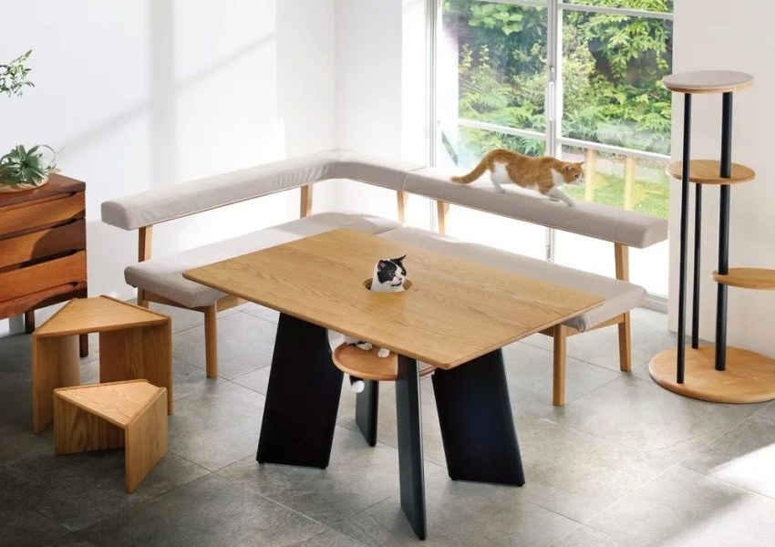 This Unique Dining Table has a Seat for Your Feline Friend