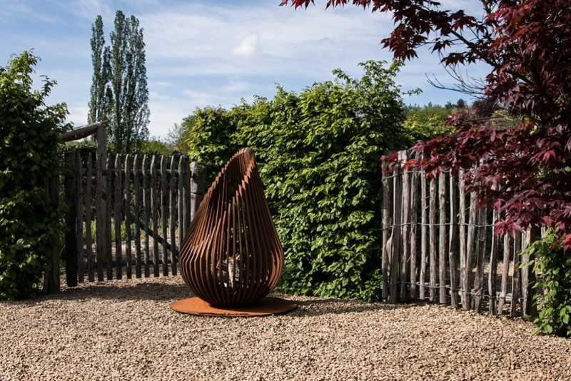 Dewdrop fire pit by Glowbus is made of Corten Steel