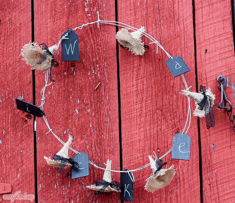 Make a creepy Halloween witch-themed wreath using barbed wire and burlap witch hats