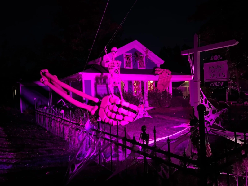 Artist Builds Gigantic Skull Arms Breaking Out of His Home for Halloween