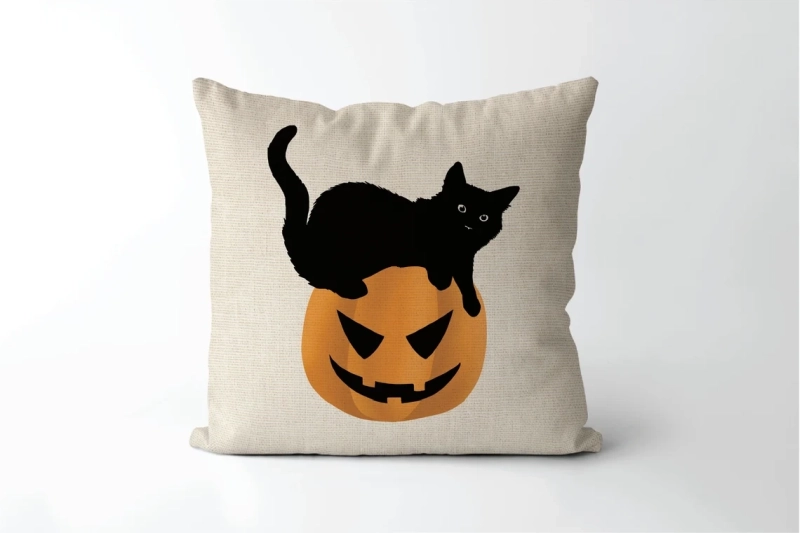 pillow with black cat and pumpkin print 