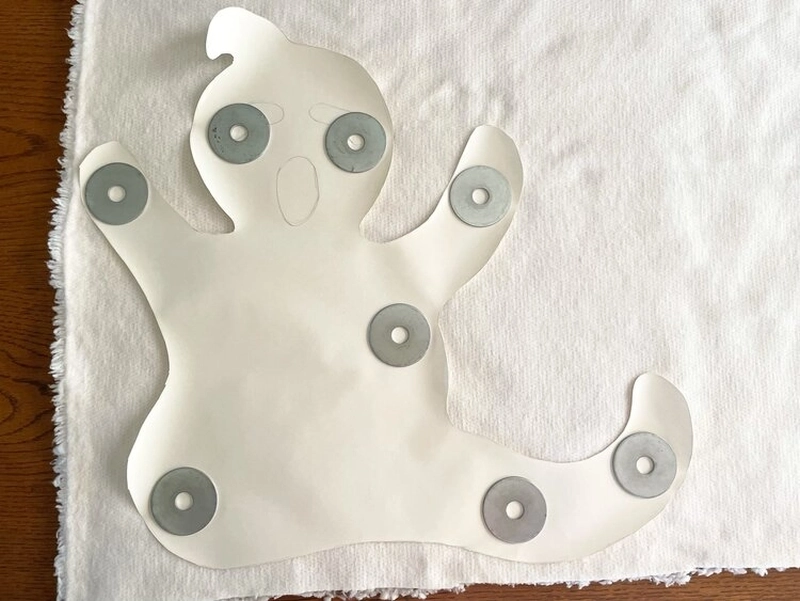 This DIY Ghost Pillow will Add Halloween Flair to Your Living Room