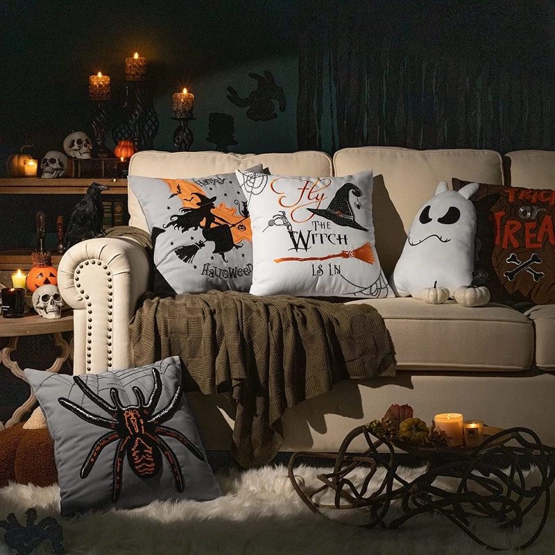 pillow covers embroidered with witches and spiders 