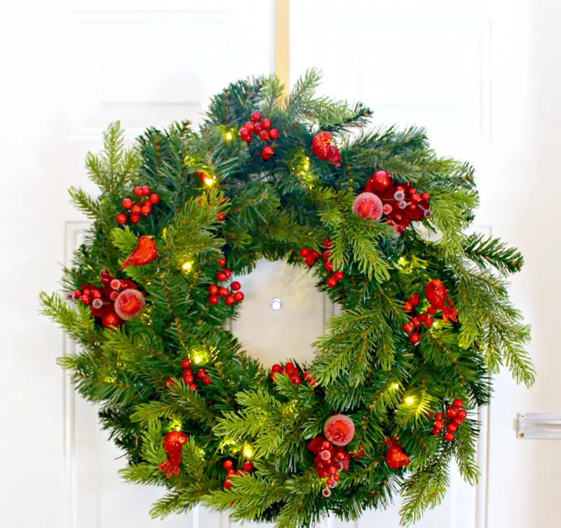 Homemade Christmas Wreath made using spruce leaves and berries 