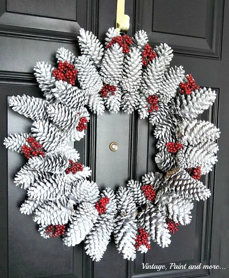 Large Christmas wreath from white painted pine cones and berries