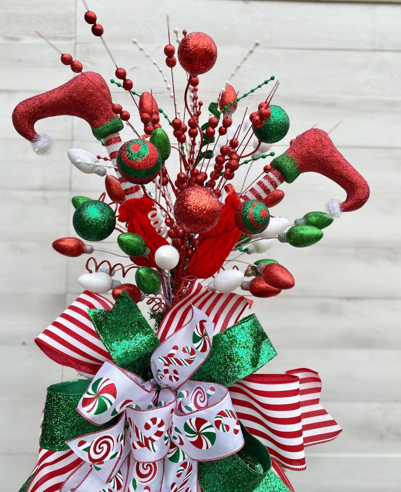 https://cdn.homecrux.com/wp-content/uploads/2021/12/elf-legs-christmas-tree-topper-new.jpg