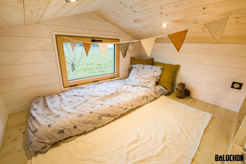 Kalzenning Tiny Touse on Wheels by Baluchon has Two Loft Bedrooms - windows