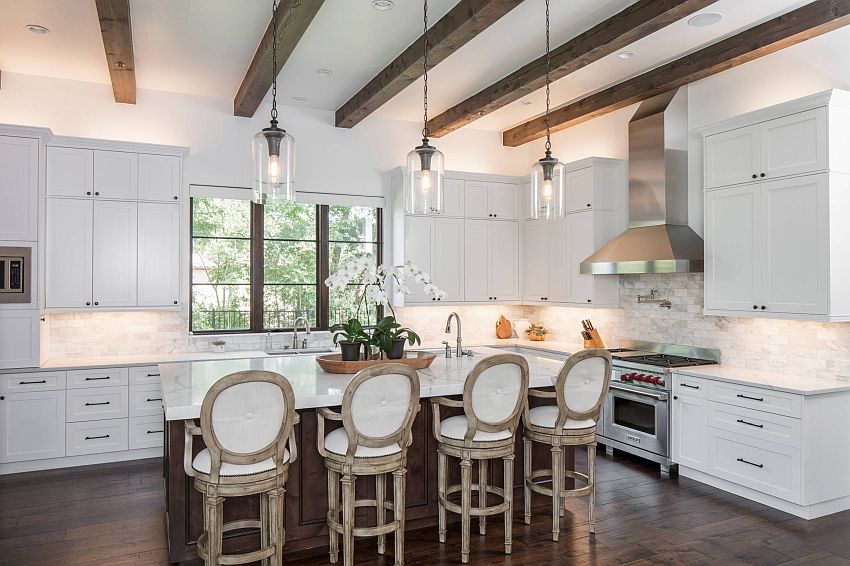 Ceiling beams bring woodsy warmth to this spacious Mediterranean style kitchen