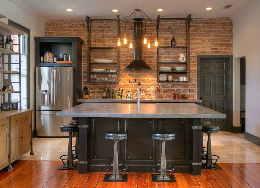 Industrial kitchen with brick accent wall