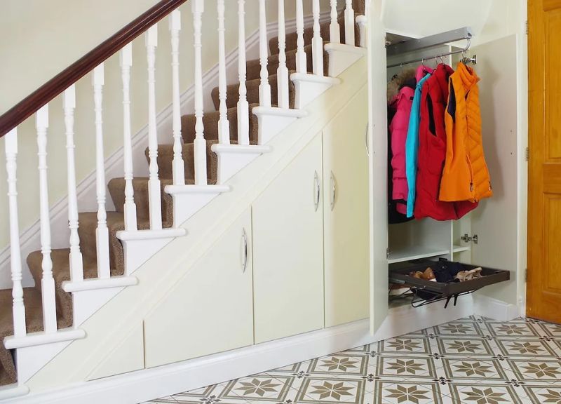 space under stairs as clothes closet _ new