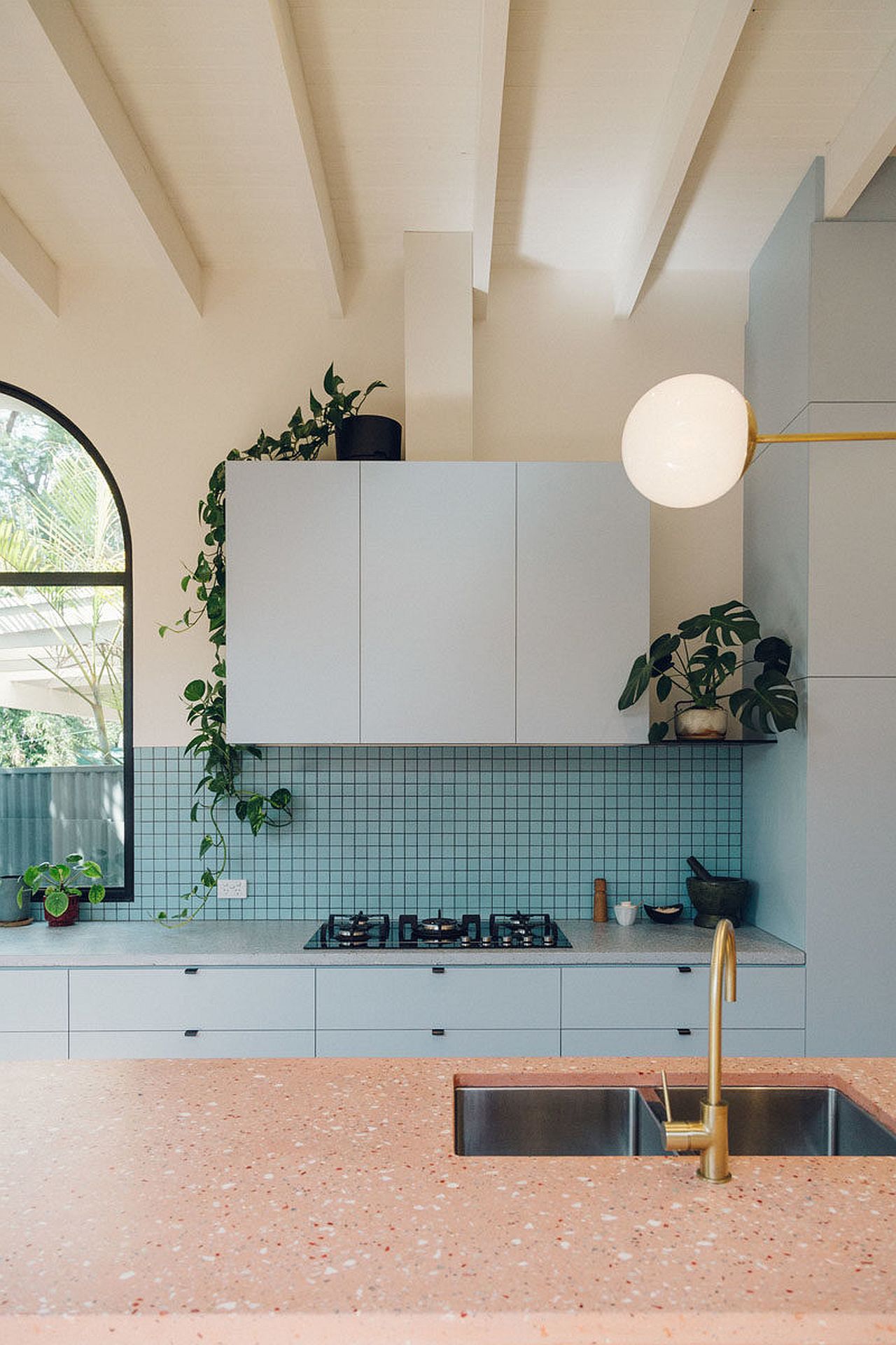 Art deco inspired kitchen with color blocks and cool lighting