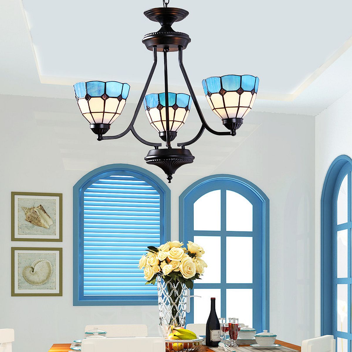 Beautiful Mediterranean style chandelier also brings a bit of blue to the room