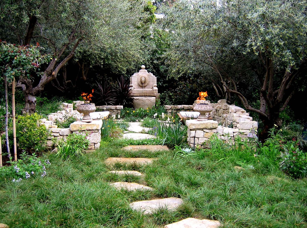 Fabulous Mediterranean style garden with water feature, fire pits and ample greenery