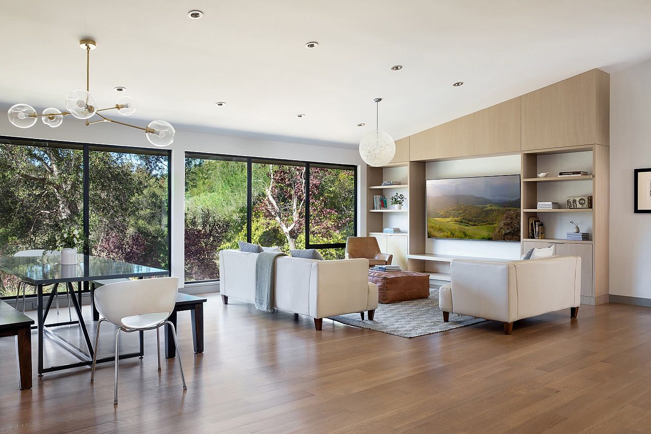 Use floor-to-ceiling glass windows to create a seamless indoor-outdoor interplay