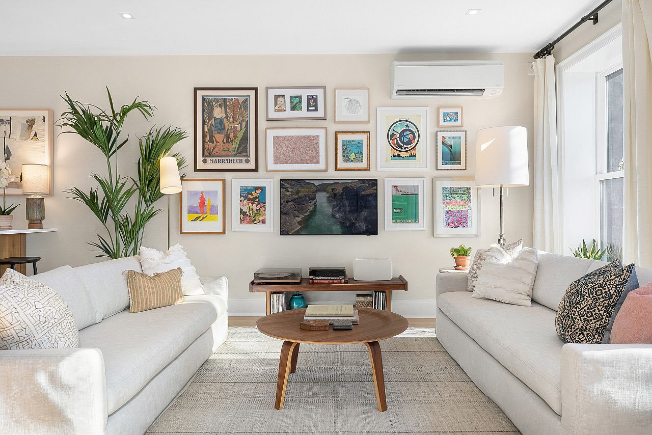 Small living room in white with decor in white where the gallery wall becomes the focal point