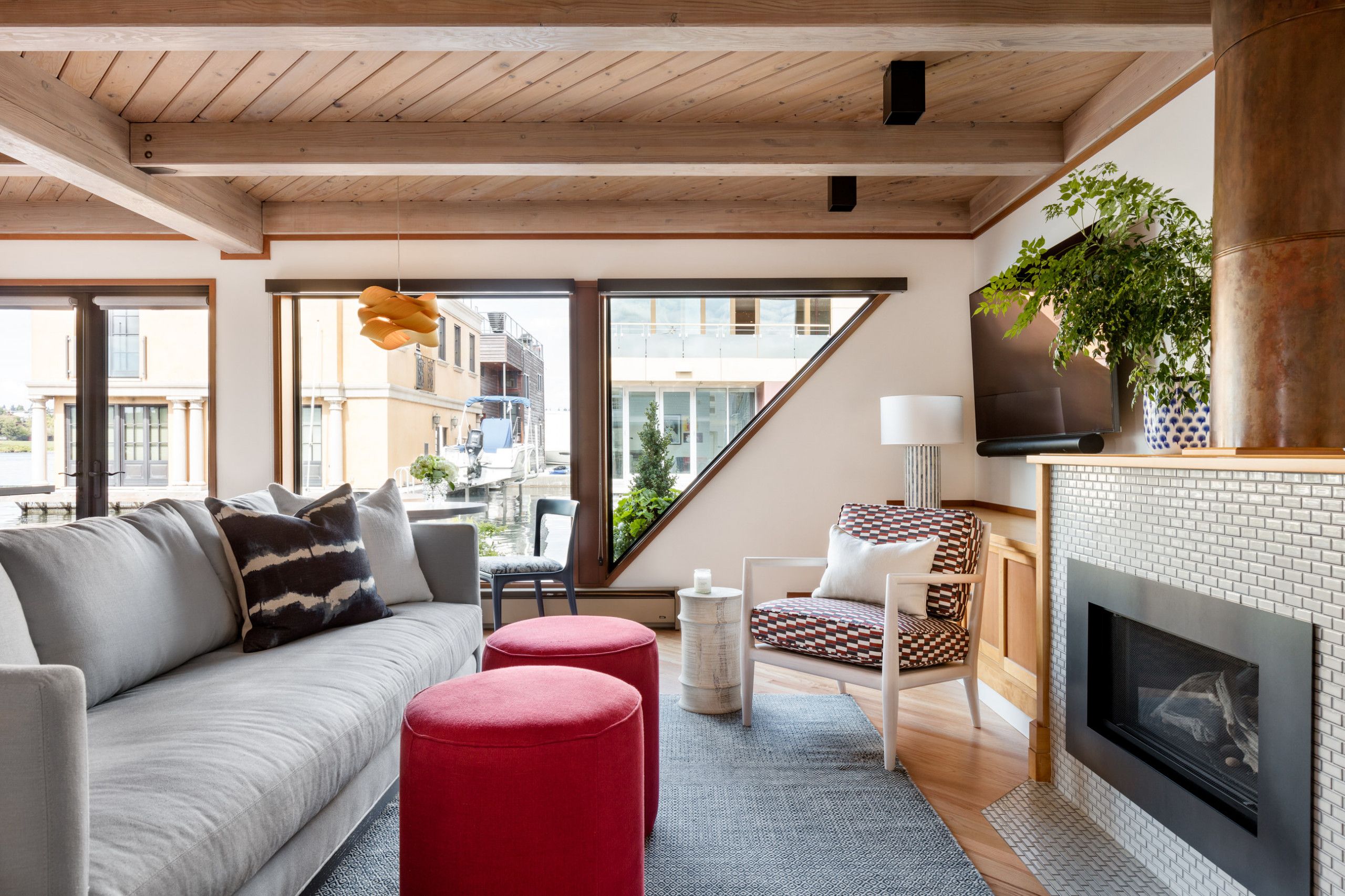 Unique windows bring natural light into the small living room