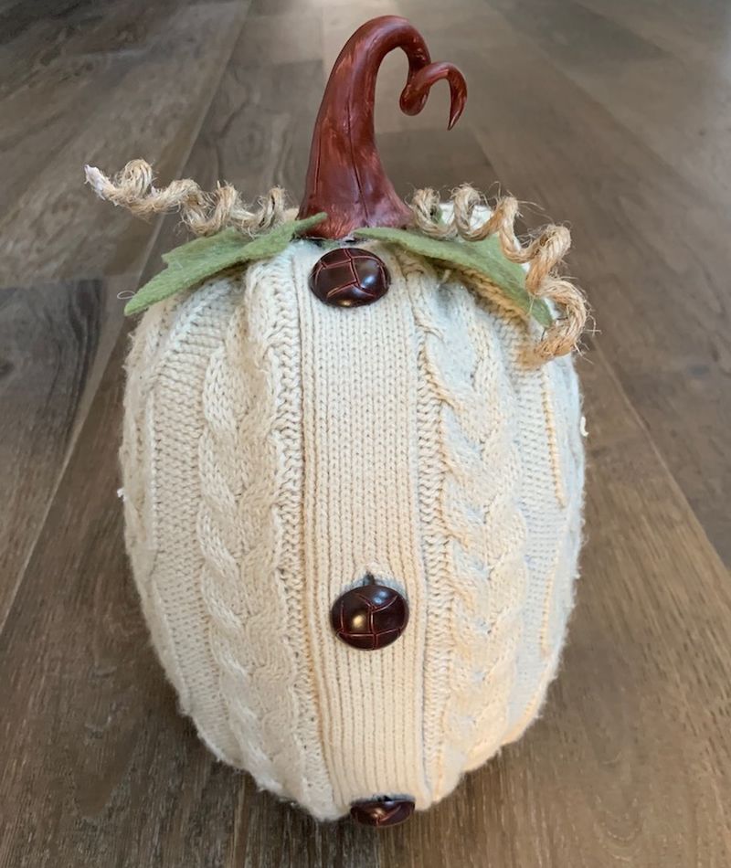 Halloween pumpkins with old sweaters and wood stem   