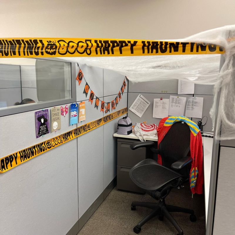 Dress the cubicle in scary theme with cautionary tapes