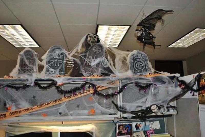 Scary tombstones on the desk for Halloween cubicle decor