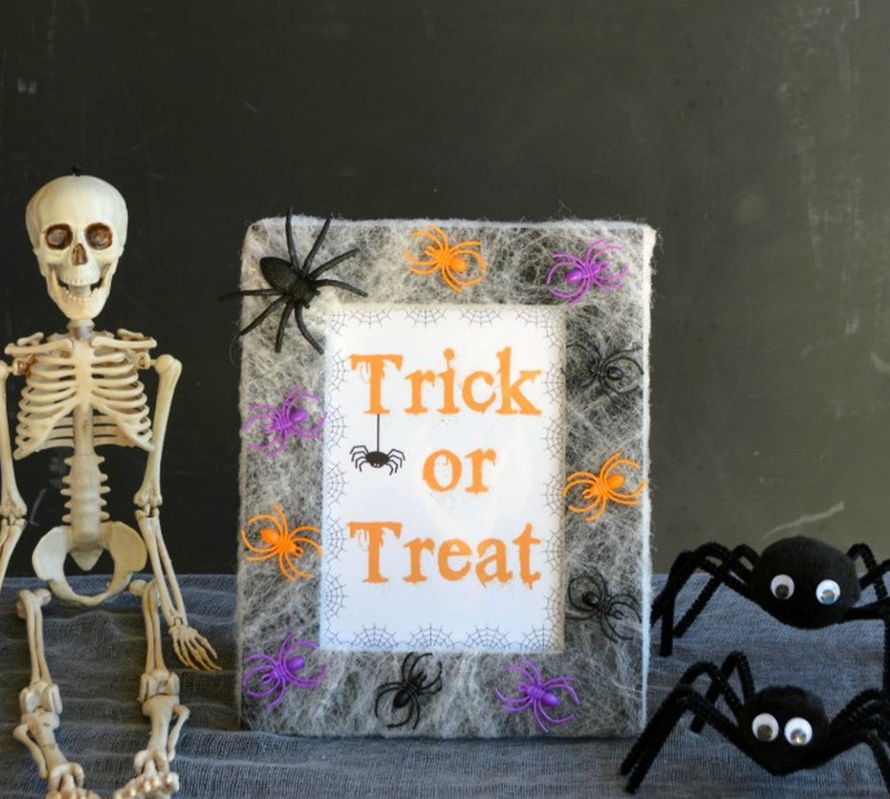 Spiders and Webs Frame - B-Inspired Mama - Ways to Use Mirror or Picture Frames for Halloween Decoration 