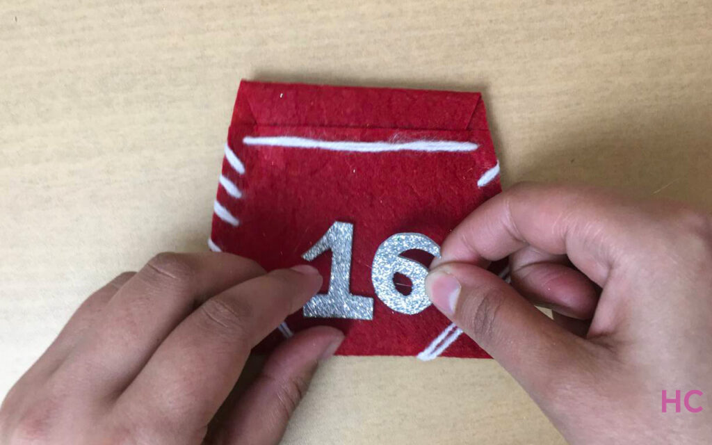 glue numbers to each felt pocket 