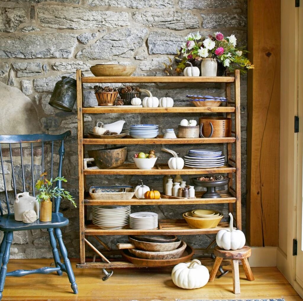 Pumpkins and Cutlery on kitchen shelf 