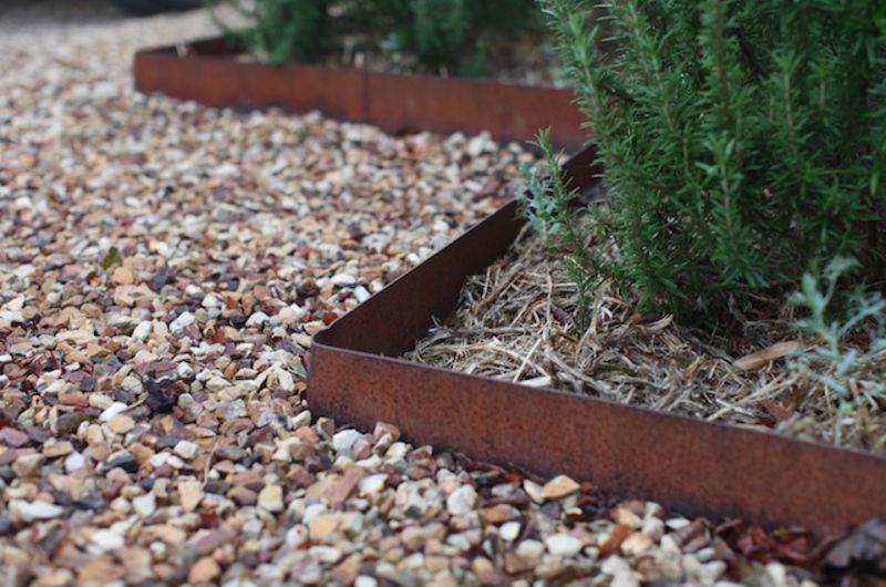 Metal edging gives a unique look to garden pathway