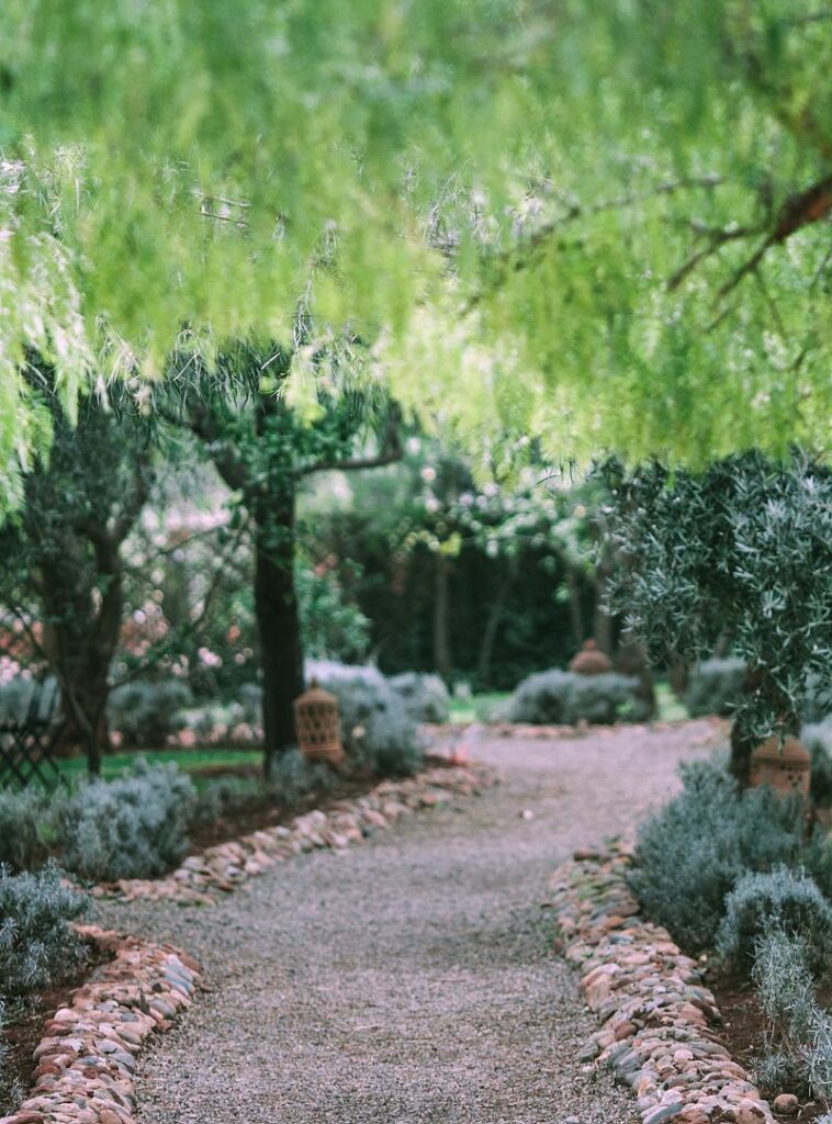 Nature inspired edging of garden walkway using river stones 