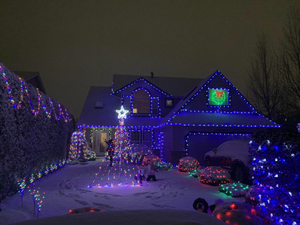 purple overtone evoked with multicolored lights outside home 